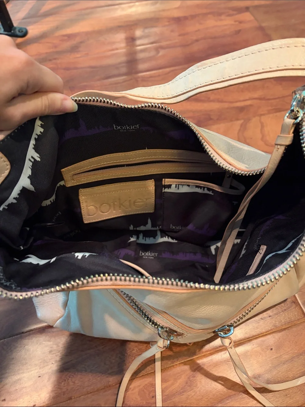 Botkier Trigger Bag Diagonal Zips Leather Tassels In Creme